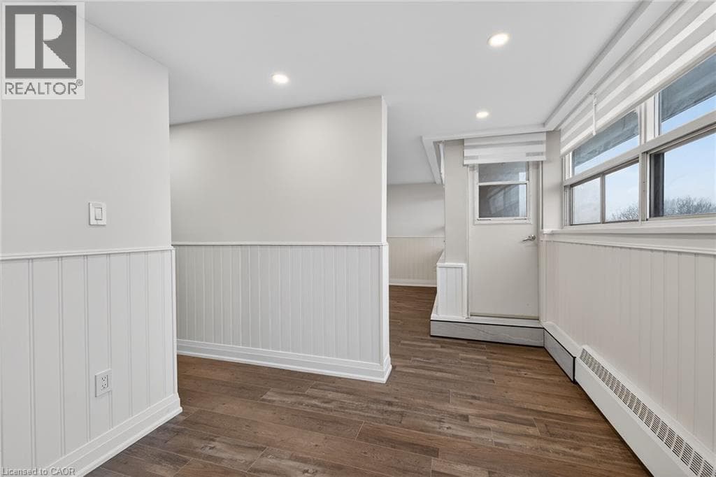 Renovated 2-bed corner condo in Kerr Village, steps to Lake Ontario, listed at $499,999 15