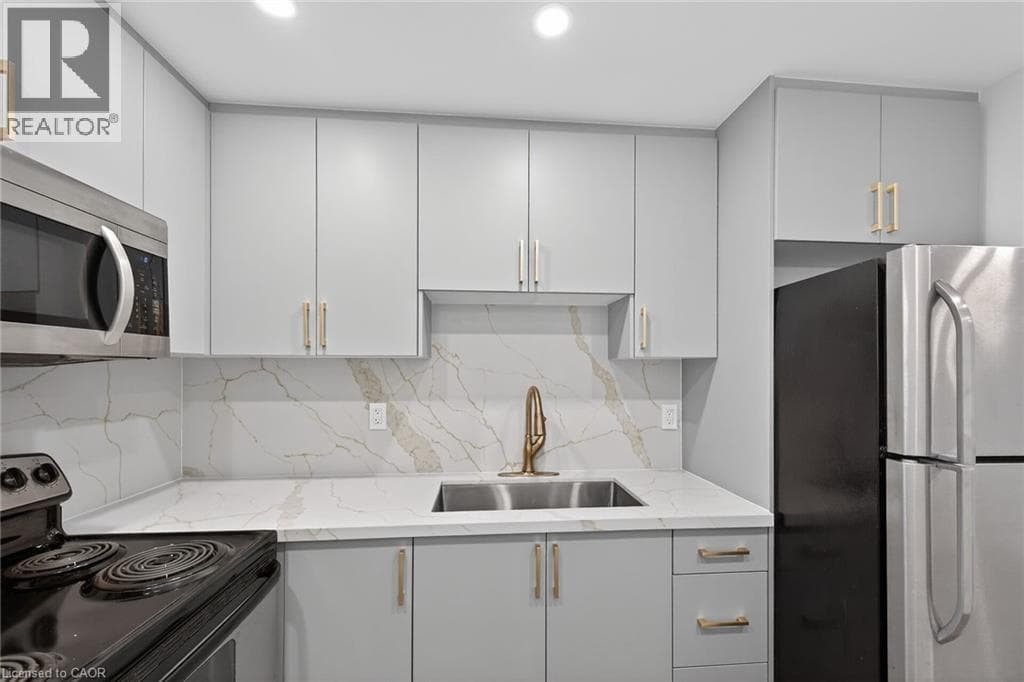 Renovated 2-bed corner condo in Kerr Village, steps to Lake Ontario, listed at $499,999 17