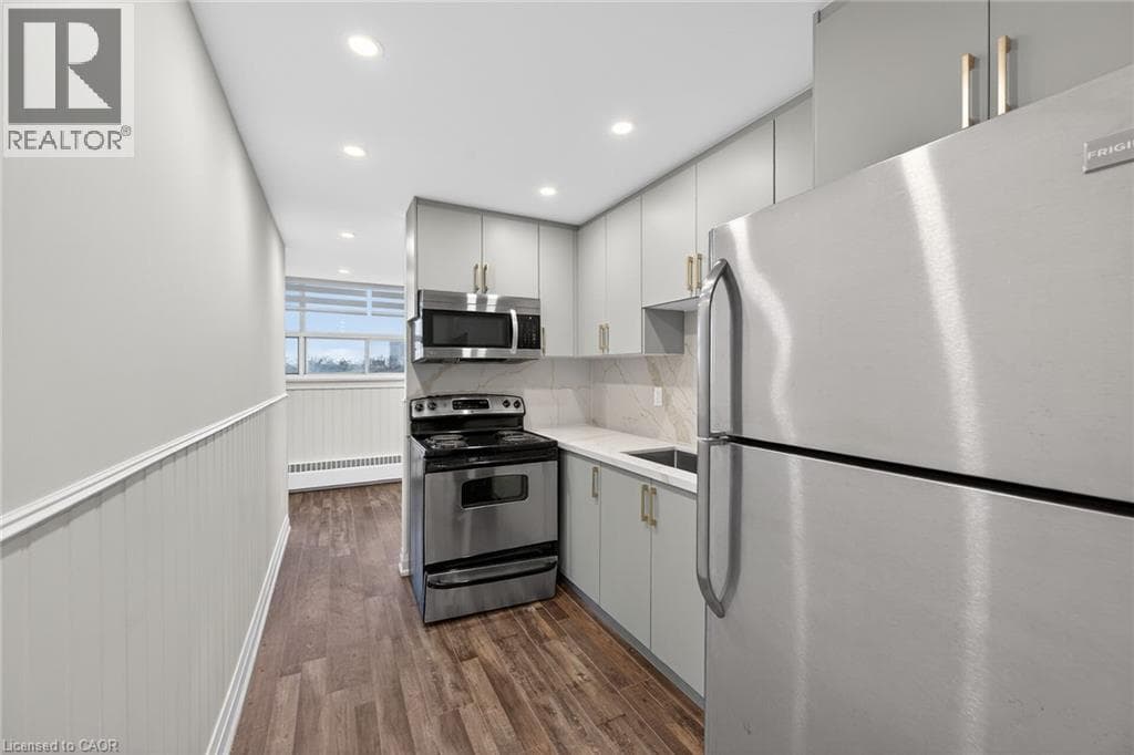 Renovated 2-bed corner condo in Kerr Village, steps to Lake Ontario, listed at $499,999 18