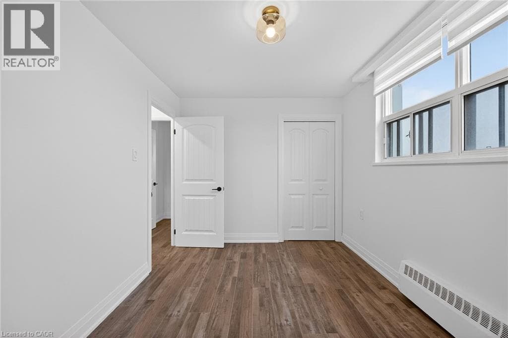Renovated 2-bed corner condo in Kerr Village, steps to Lake Ontario, listed at $499,999 24