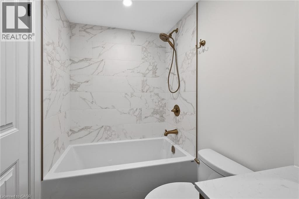Renovated 2-bed corner condo in Kerr Village, steps to Lake Ontario, listed at $499,999 26