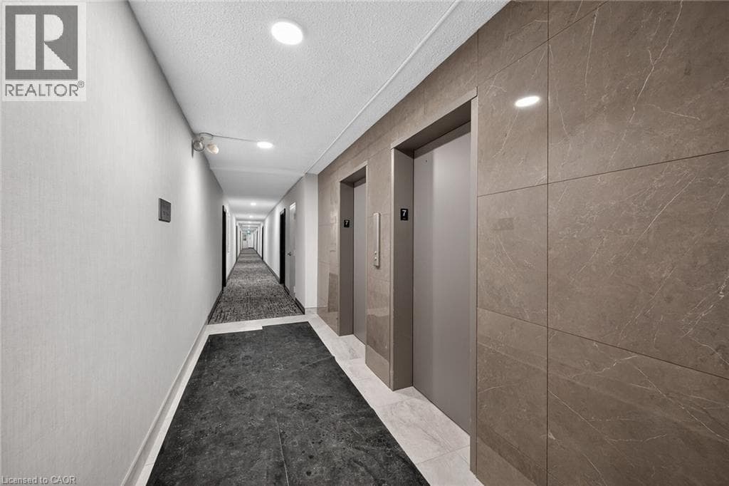 Renovated 2-bed corner condo in Kerr Village, steps to Lake Ontario, listed at $499,999 28