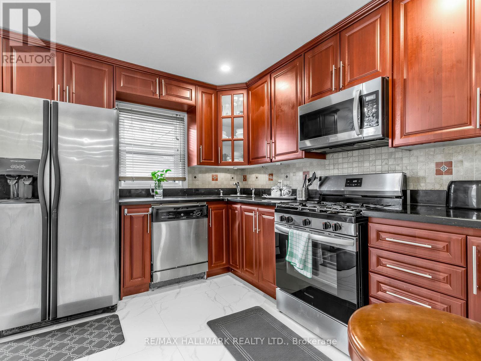 3+1 bed Danforth townhouse steps to Donlands Subway with double laneway garage 11