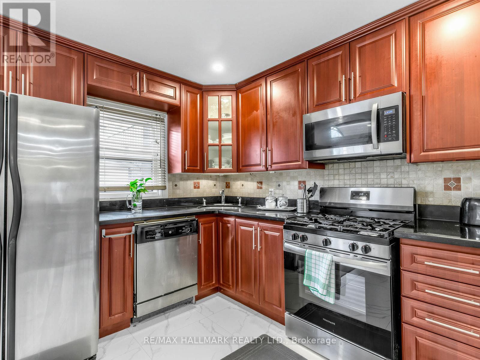 3+1 bed Danforth townhouse steps to Donlands Subway with double laneway garage 12
