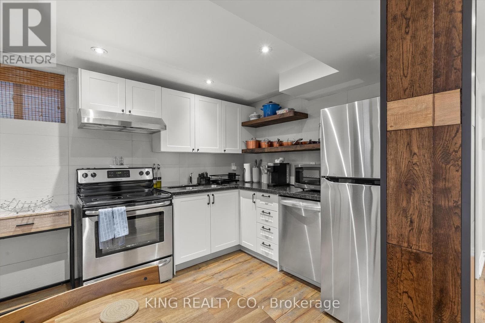 Detached Oakwood Village 4-bed with legal-style basement suite on 125-foot L-shaped lot 23