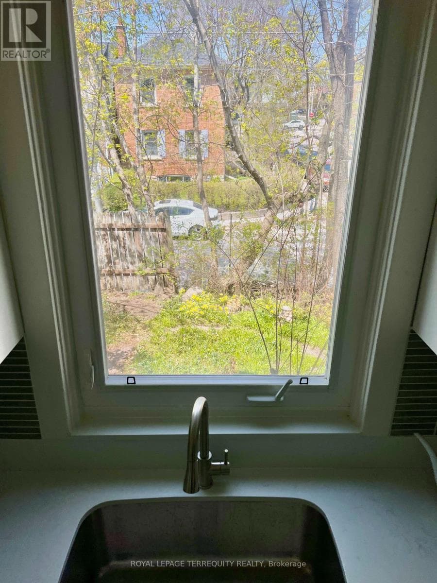 Danforth corner-lot detached with separate-entrance suite potential at $880,000 12