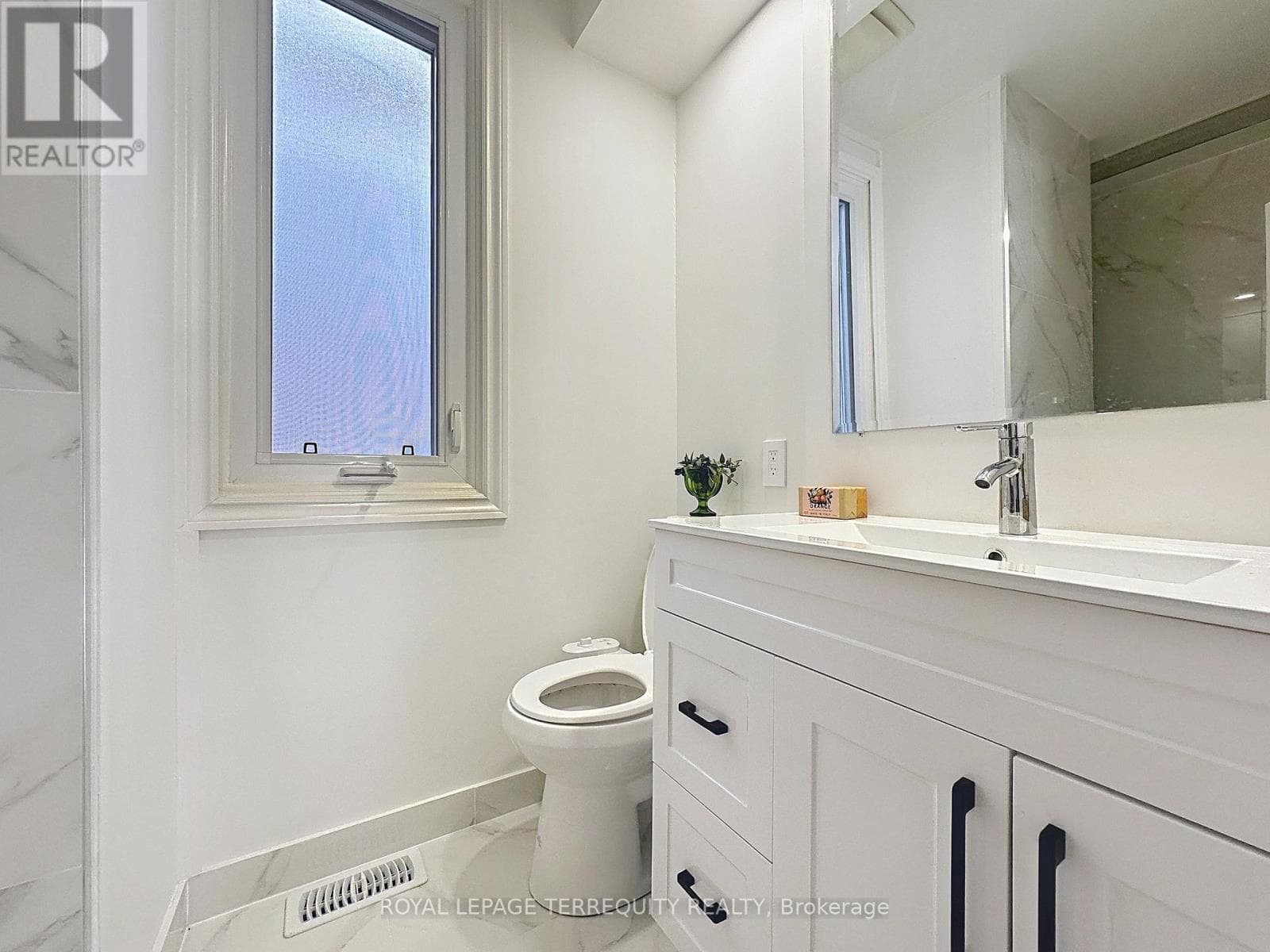 Danforth corner-lot detached with separate-entrance suite potential at $880,000 20