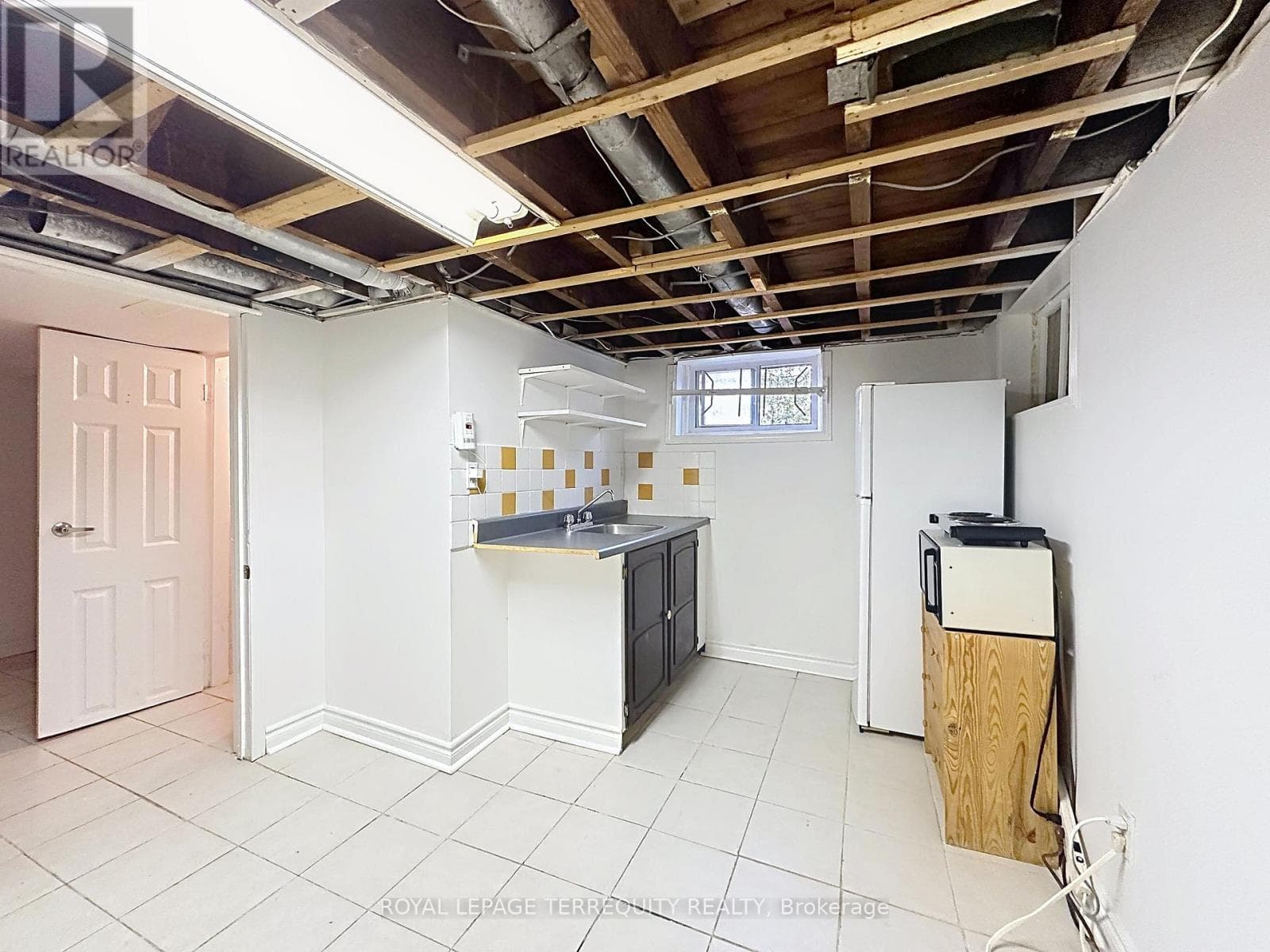Danforth corner-lot detached with separate-entrance suite potential at $880,000 24