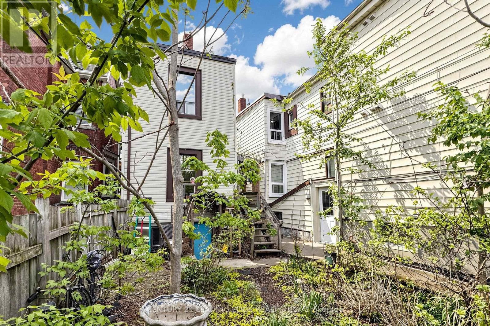 Detached duplex steps from Dufferin Station with garden suite upside on a 120-foot lot 32