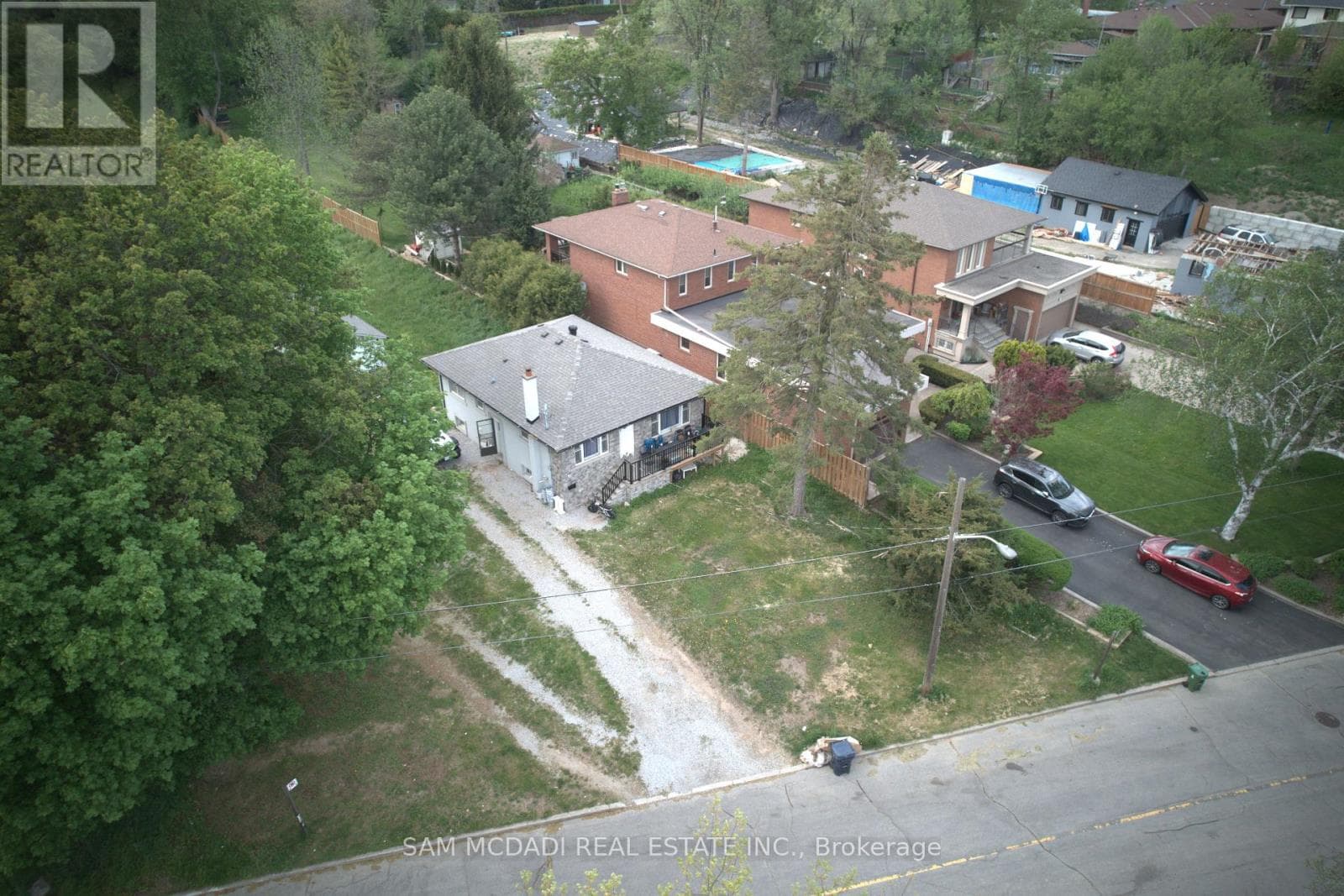 Humber Summit double-lot bungalow (100 x 459 ft) with redevelopment potential, listed $1,999,888